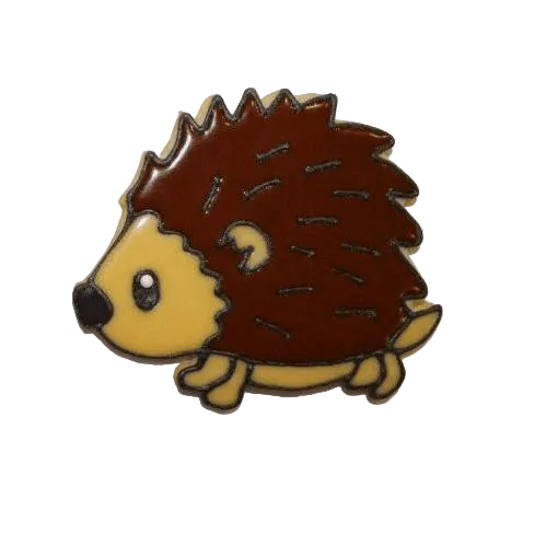 A pink cookie cutter in the shape of a hedgehog with a brown sugar coating on top, made out of pink plastic.